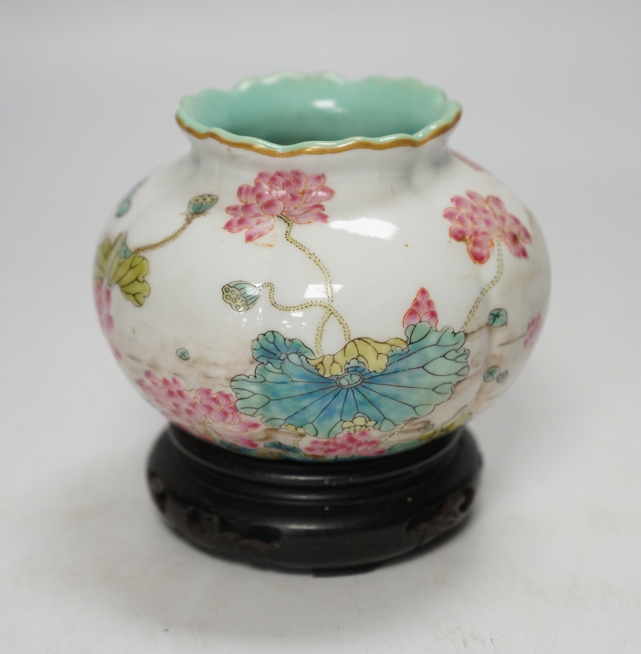 A Chinese famille rose water pot, Qianlong mark but later, on hardwood stand 9cm